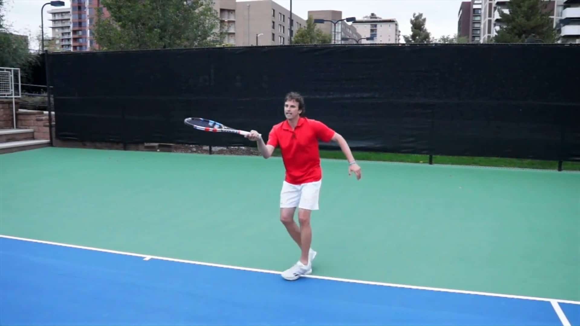 Jeff Salzenstein demonstrating the finish of a forehand drop shot tennis follow through.